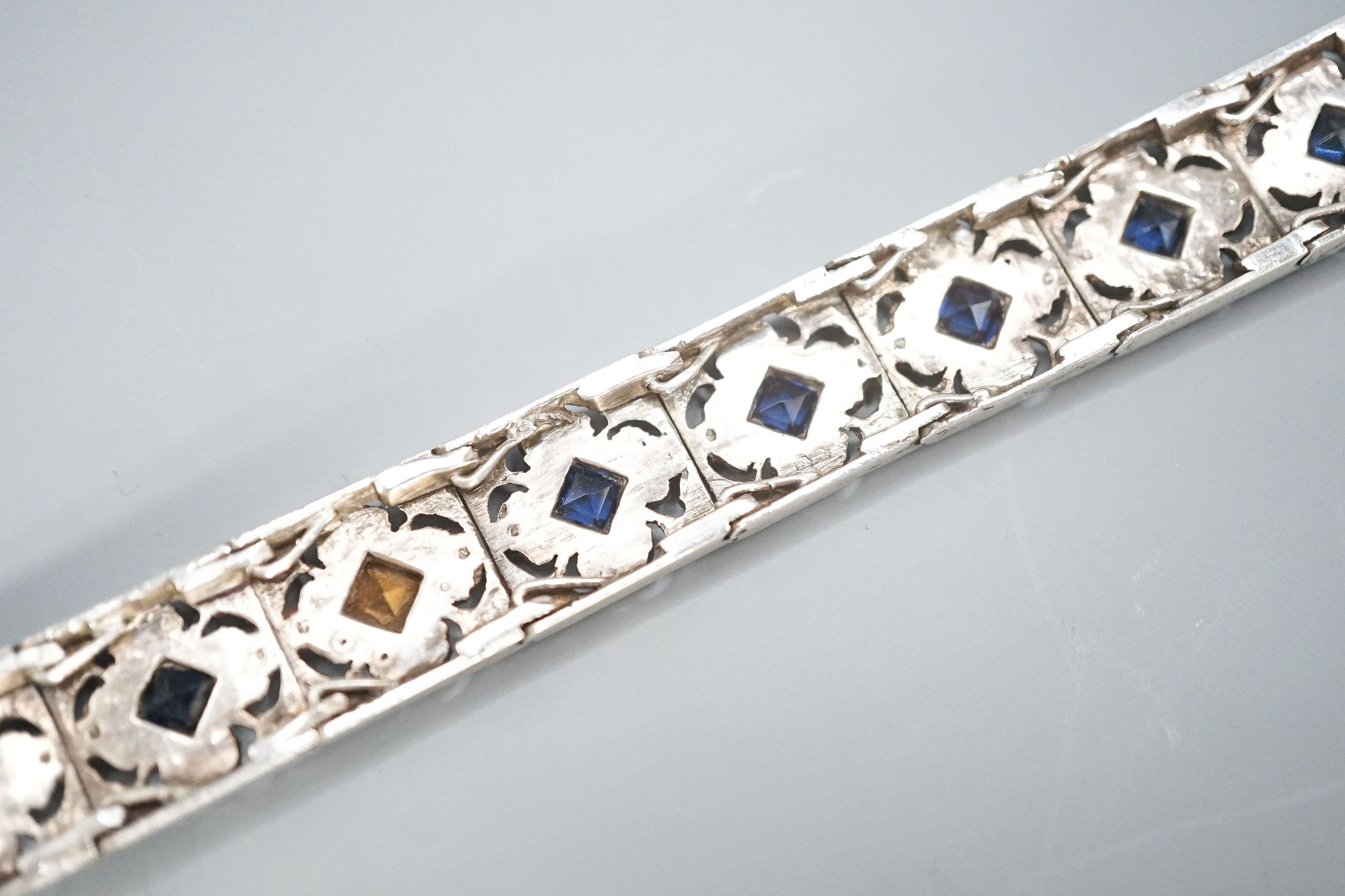 A white metal and two colour paste set bracelet.